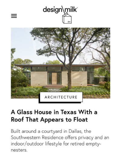 Modern house with large windows nestled among trees, giving an illusion of floating architecture.