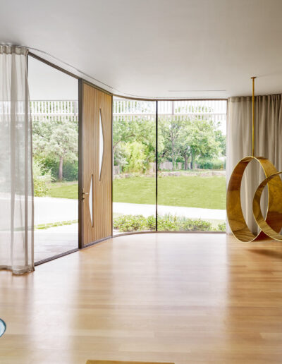 Home interior design with gold swings hanging from ceiling.