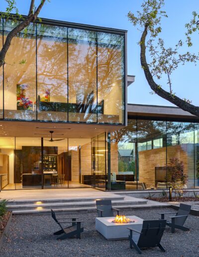 Luxury home back of the house angle with fire pit in yard